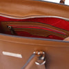 Internal Zip Pocket View Of The Cognac Genuine Leather Handbag