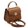 Angled And Shoulder Strap View Of The Cognac Italian Handbag