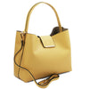 Angled And Shoulder Strap View Of The Pastel Yellow Leather Handbag For Women