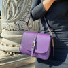 Woman Posing With The Purple Leather Over Shoulder Bag